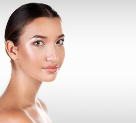 Fototapeta premium Portrait of pretty woman against a grey background with copyspace, ,skin care concept