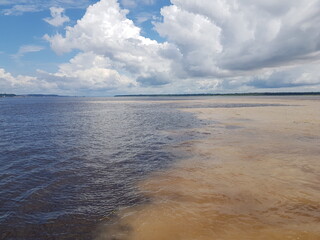 The Meeting of Waters (Portuguese: Encontro das Águas) is the confluence between the Rio Negro, a...