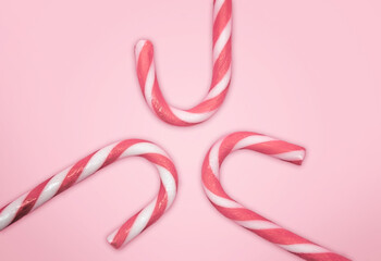 Rose and White Candy Cane on Light Rose Background