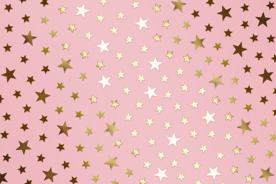 Fototapeta All Over Gold Star Confetti on Light Rose Background