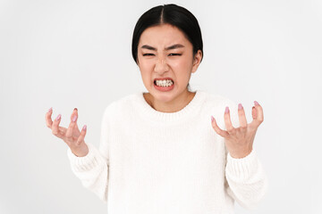 Asian brunette furious girl grimacing while posing on camera
