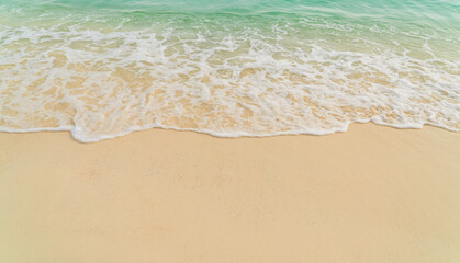 Fototapeta na wymiar waves on the sand beach overhead 