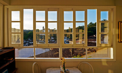 Panoramic window with view of historical city at dusk, Ouro Preto, Brazil