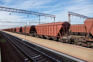 grain carrier freight car for transportation of bulk cargo of grain crops, railway track with rails...
