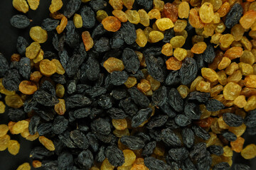 Dried raisins on white background