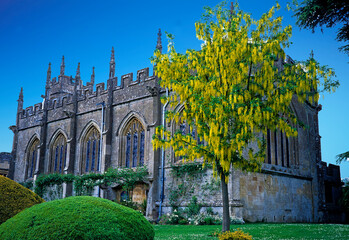 VIEW THE CHAPEL WITH LABURNUM TREE  IN THE WHITE GARDEN AT SUDELEY CASTLE