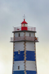 Lighthouse tower at the sunset. Santa Marta Lighthouse in Cascais, Portugal	