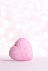 Obraz premium Valentines day greeting card , pastel pink heart on gentle pink background with bokeh and place for text .Vertical.