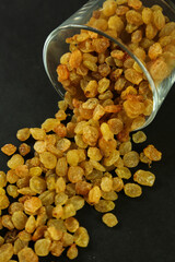 Dried raisins on white background