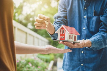 Businessman giving key and house to customer concept business finance rent sale service family home...
