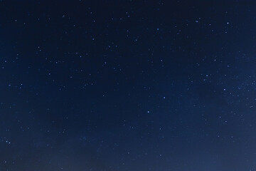 Naklejka na ściany i meble Background of night sky with many stars