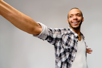 Naklejka premium Happy african american man using mobile phone for video call