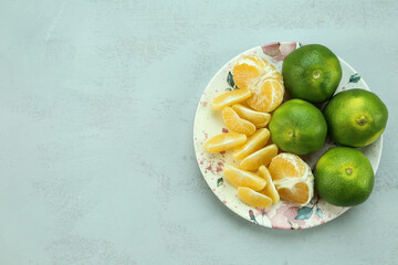 Green sweet tangerines growing with background