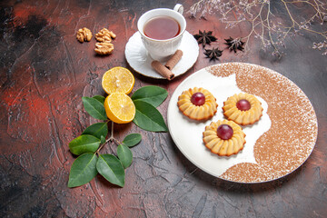 half-top view little cookies with cup of tea on dark background sugar biscuit cake sweet