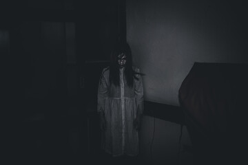 Portrait of asian woman make up ghost face with blood,Horror scene,Scary background,Halloween...
