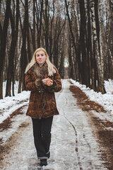 Girl in the winter forest