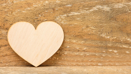 Wooden heart on a wooden table