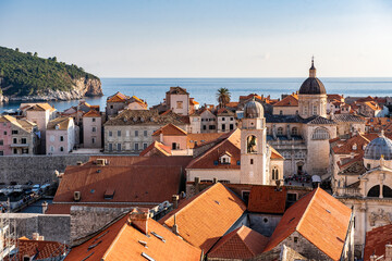 Fototapeta na wymiar View of red tiled roofs and Adriatic sea in the city of Dubrovnik, Croatia