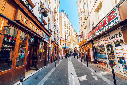 Paris, France - circa May, 2017: Image of street scene from the Latin Quarter on the left bank of Paris France. Latin Quartier is the traditional area known for lively atmosphere and bistros