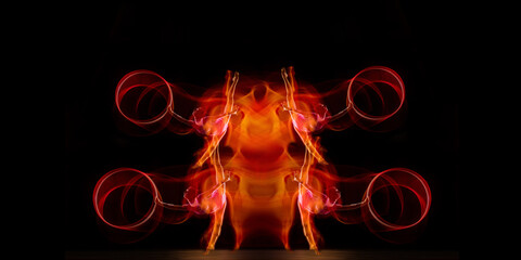 Young flexible girl isolated on red studio background. Little flexible girl isolated on black studio background. Fire flames, reflection, strobe light effect. Grace in motion, sport, action. Flyer