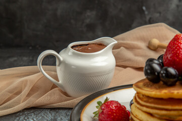 front view delicious pancakes with honey and fruits on light background cake sweet fruit