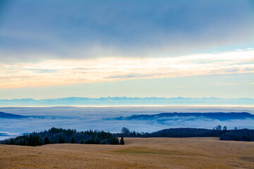 Naklejka na ściany i meble landscape with a sea of clouds in the valley seen from the mountain