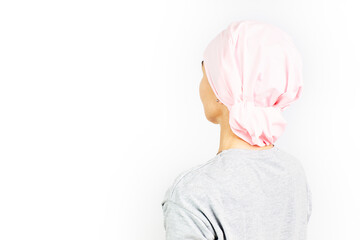 Woman with a pink headscarf for cancer