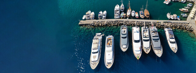 Aerial drone top down ultra wide photo of sail boats anchored in port and Marina of main town of...