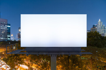 Blank white road billboard with Bangkok cityscape background at night time. Street advertising poster, mock up, 3D rendering. Front view. The concept of marketing communication to promote idea.