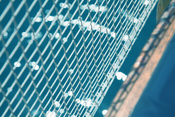 Close up rope knots rope on sea water background as symbol of travel and holiday.