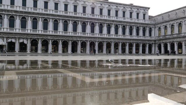 Venice, Italy - December 2020 - San Marco square, monuments reflected on the high water