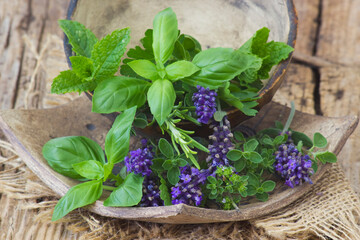 Freshly harvested herbs on a clay plate