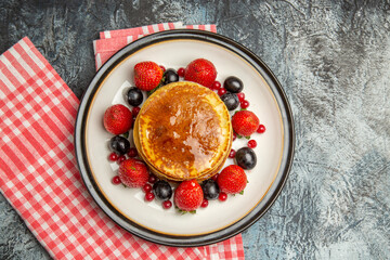 top view yummy pancakes with honey and fruits on light background milk sweet fruit cake