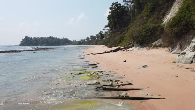 A static video image of a remote beach on an old volcanic island in the Andaman Nicobar Island chain with ancient forests and white sand on a hot sunny day in the dry season