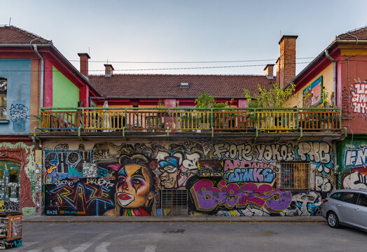 Ljubljana, Slovenia - August 21, 2020: A panorama picture of a building with street art on display at the Metelkova Art Center.