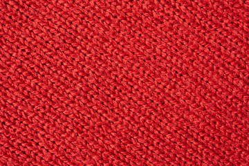 Red knitted wool texture background