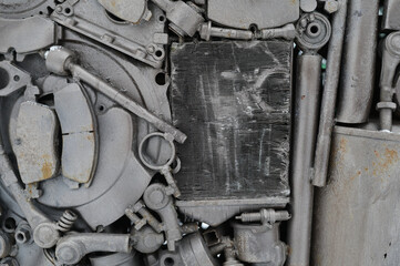 Conceptual photo of gray metal auto parts.
