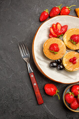 top view delicious pancakes with fruits on the dark background pie fruit cake sweet