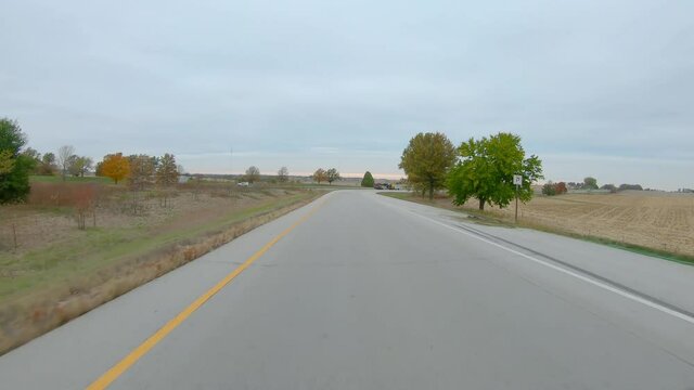 POV While Driving On Entrance Ramp On To Interstate I74 In Rural Eastern Iowa; Flat, Agriculture Landscape