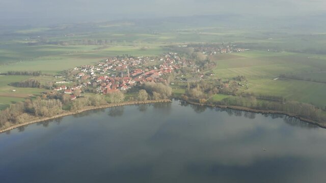 Drone Aerial of the Lake Seeburg Seeburger See on a beautiful sunday morning in the Harz national Park near G&ouml;ttingen in central germany.