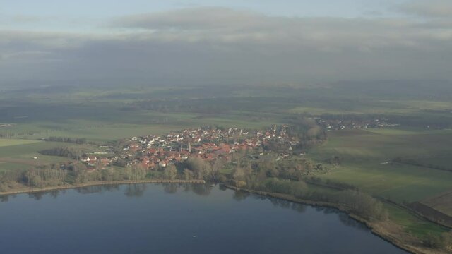 Drone Aerial of the Lake Seeburg Seeburger See on a beautiful sunday morning in the Harz national Park near G&ouml;ttingen in central germany.