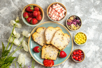 top view yummy cake slices with strawberries on light background pie cake fruit sweet