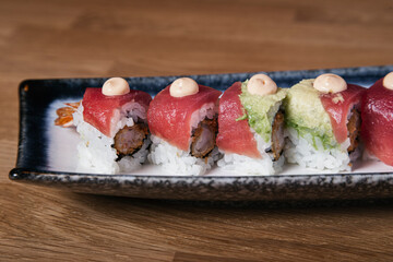Close up of shrimp urimaki covered with tuna tataki.