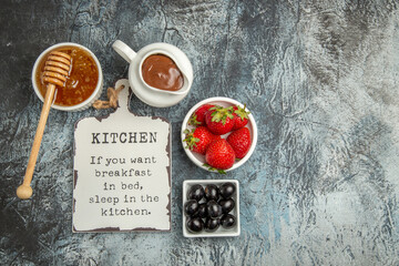 top view fresh strawberries with funny desk and honey on a dark background sweet fruit berry
