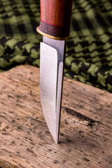 handmade knife on a background of shemag