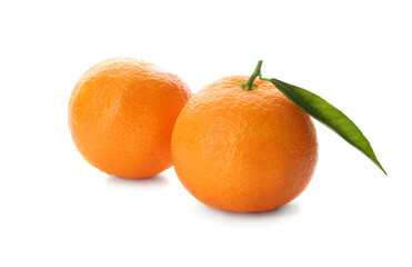 Whole fresh tangerines with green leaf on white background