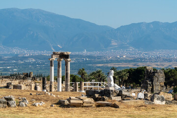 Hierapolis, Pamukkale,Turkey. June 3, 2019: Ruins and statue of Pluto in Hierapolis, Ancient City.