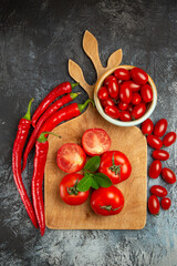 top view fresh red tomatoes with peppers on dark-light background ripe salad food photo