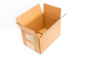 open big empty brown square cardboard box for transporting goods on white background,