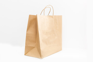 brown clear empty blank craft paper bag for takeaway isolated on white background. Packaging template mock up. Delivery service concept. Copy space.